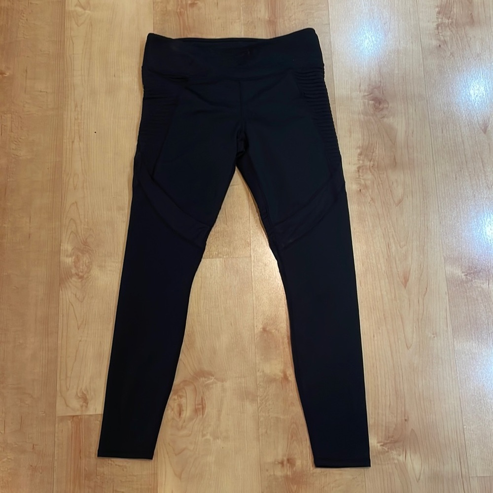 Fabletics black leggings with sheer cut out.